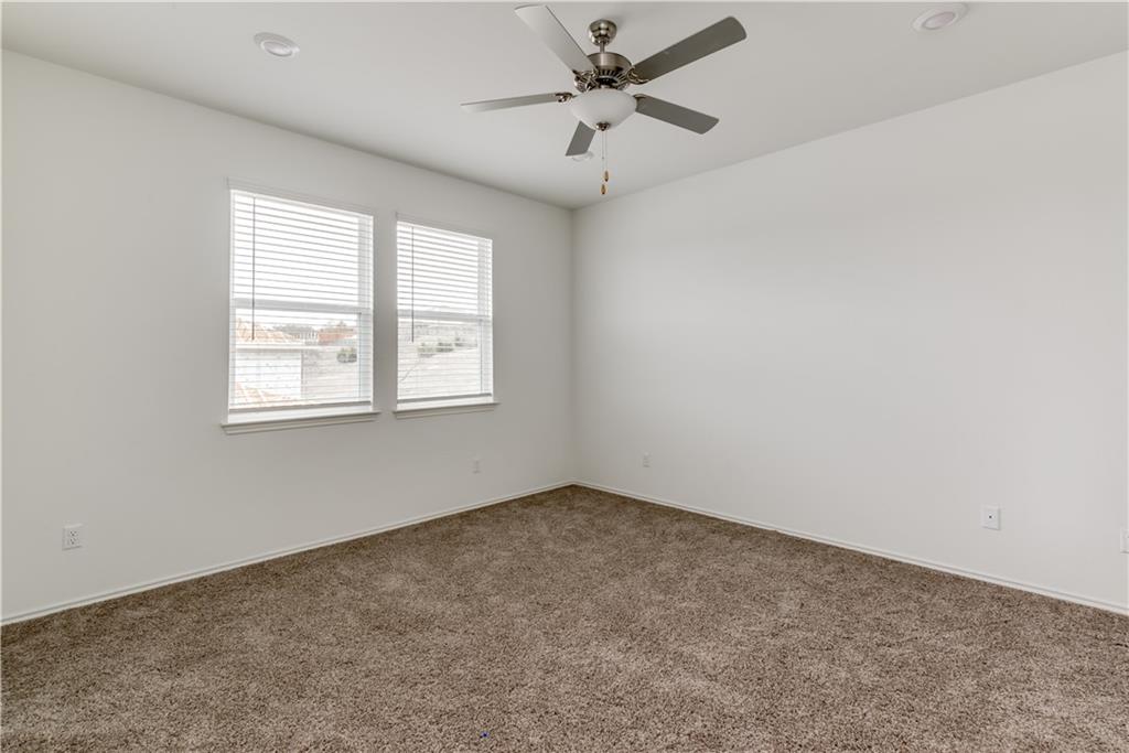 712 Affazia Lane Georgetown, TX 78628 - Photo 20 of 40 an empty room with a window and a fan