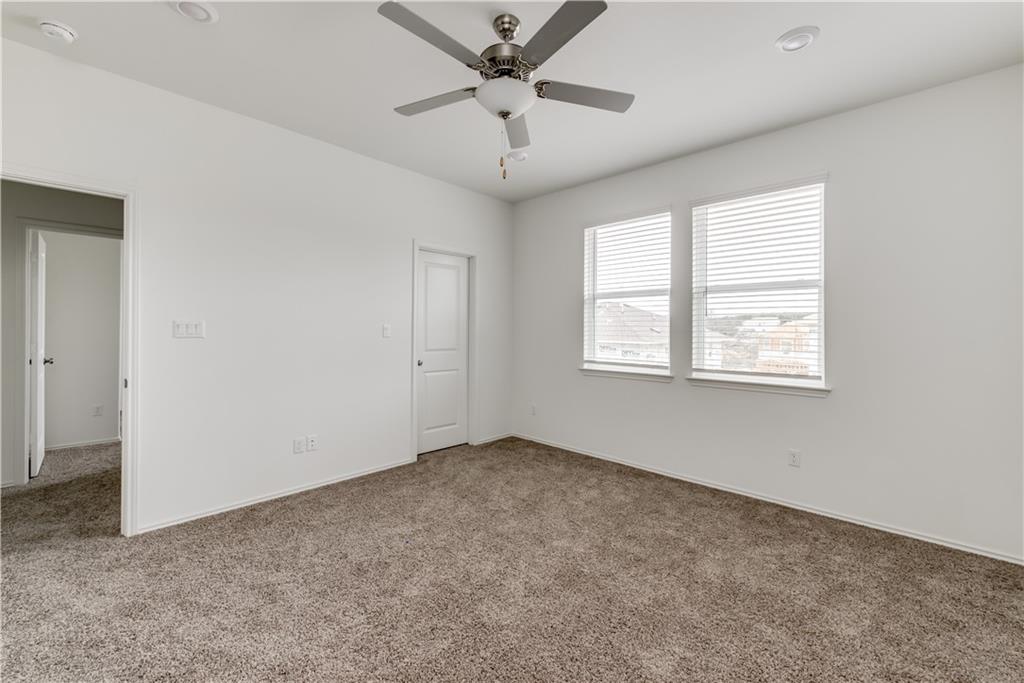 712 Affazia Lane Georgetown, TX 78628 - Photo 21 of 40 a view of an empty room with a window