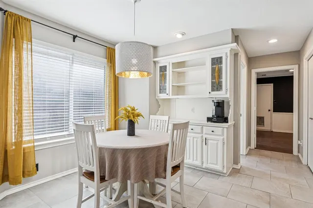 a kitchen with stainless steel appliances granite countertop a stove and a refrigerator