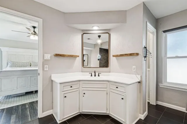 a bathroom with a double vanity sink mirror and double