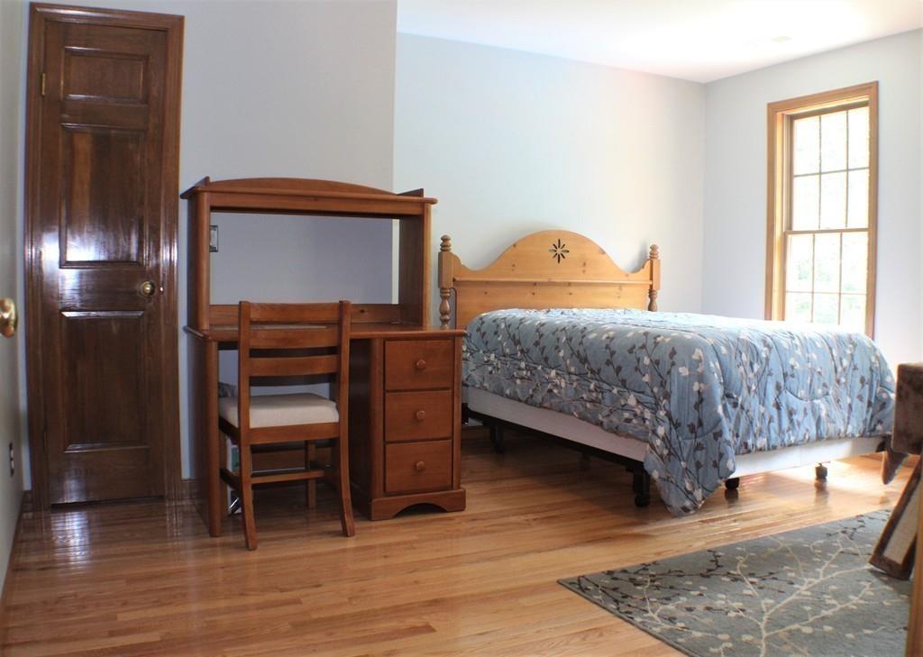50 Ragged Hill Road West Brookfield, MA 01585 - Photo 23 of 31 a bedroom with a bed and wooden floor
