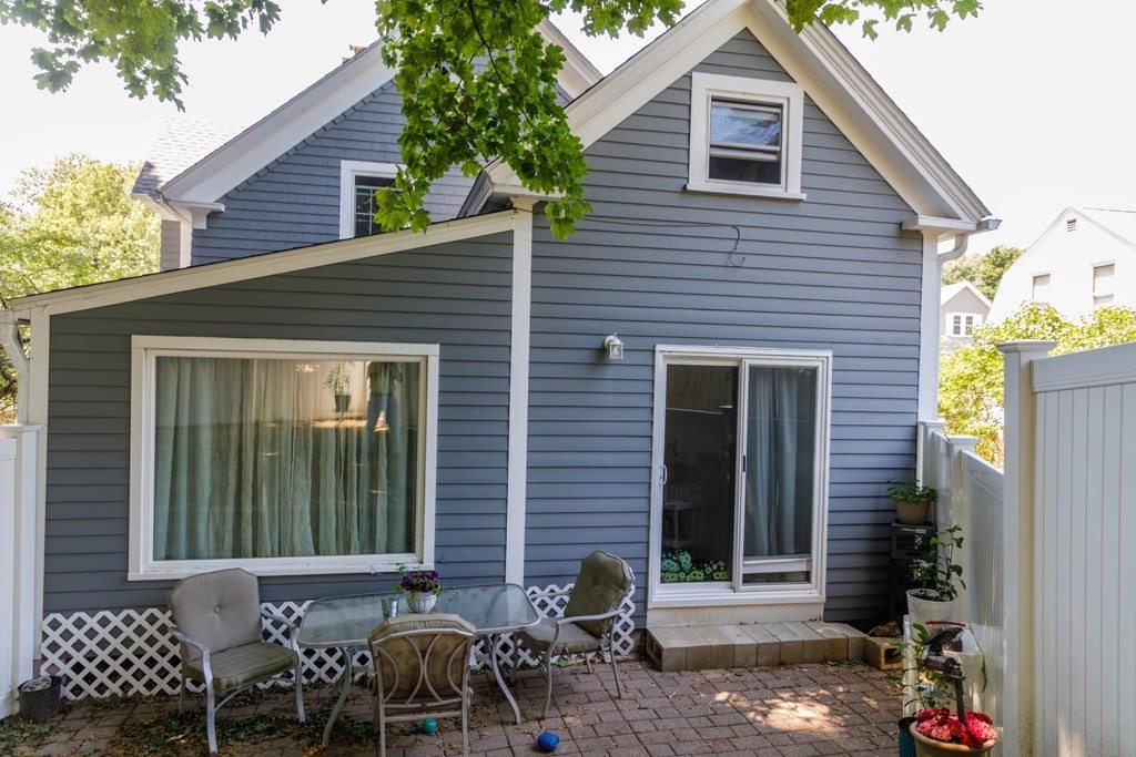 26 Lovell Road Holden, MA 01520 - Photo 21 of 26 a view of a patio with table and chairs and potted plants