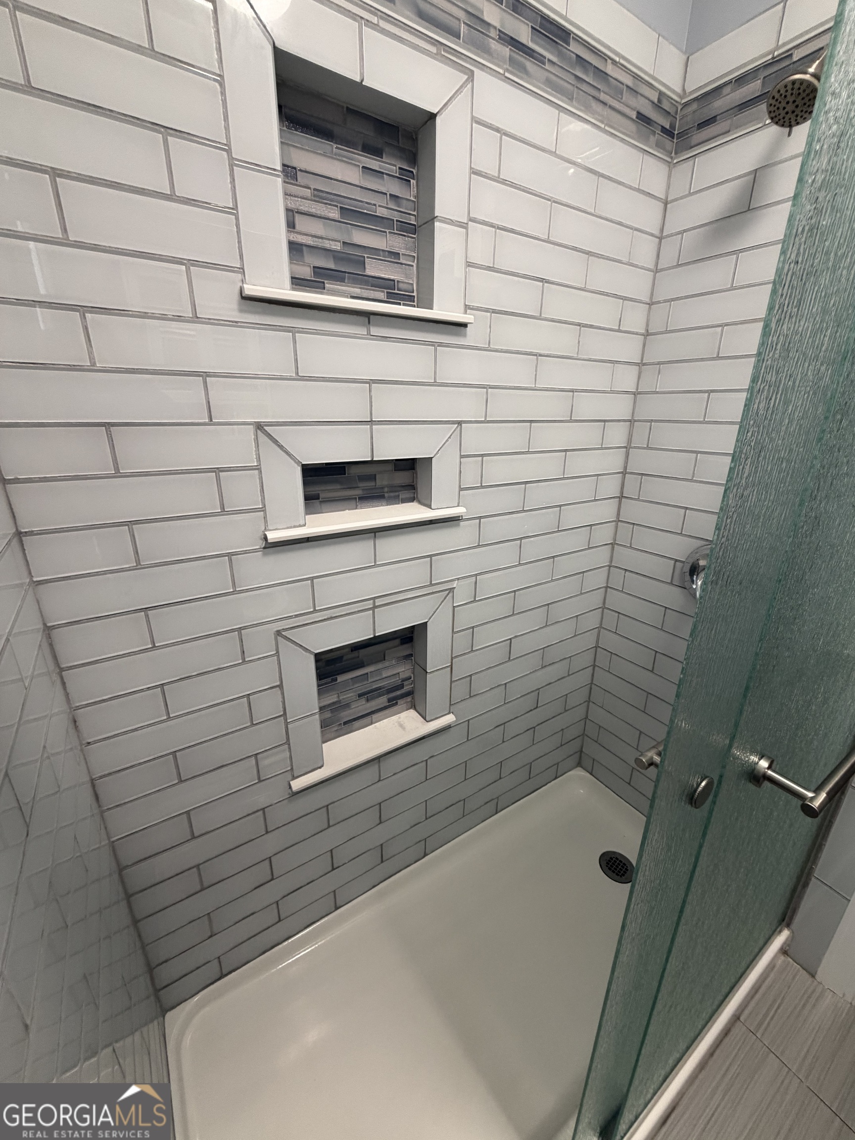 430 Bethany Road Covington, GA 30016 - Photo 18 of 39 a bathroom with a shower