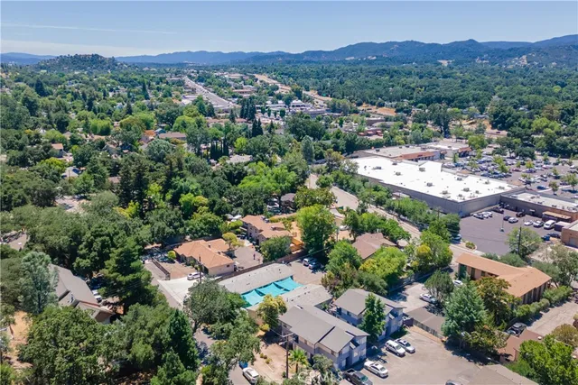 an aerial view of a house with a lot of trees