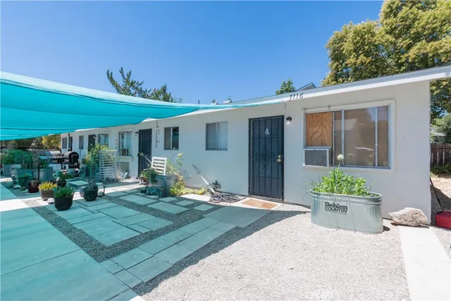 a view of a house with porch and sitting area