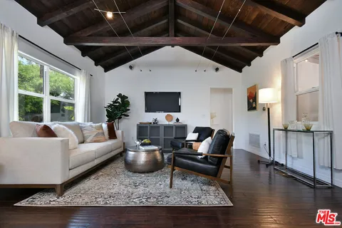 a living room with furniture and a rug