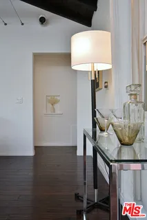 a kitchen with stainless steel appliances kitchen island granite countertop a stove and a view of living room