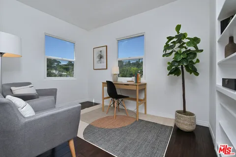 a view of a dining room with furniture and window