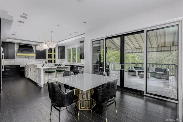 a dining room with furniture and wooden floor