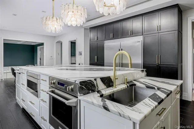 a kitchen with a stove and a sink