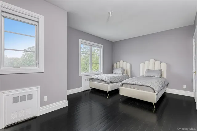 a bedroom with bed and window