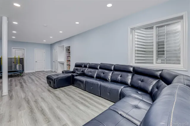 a bedroom with two beds and a couch