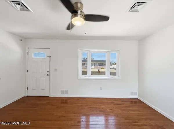 a kitchen with a stove a sink and a microwave