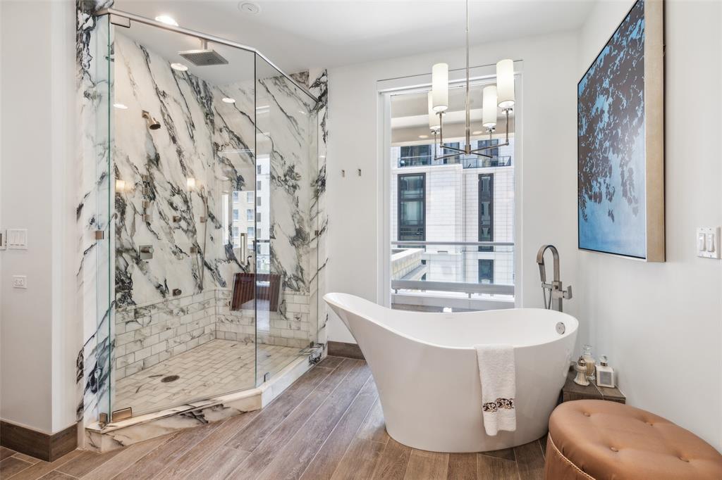 2300 Wolf Street, Unit 3D Dallas, TX 75201 - Photo 17 of 37 a view of a bathroom with a bathtub and shower