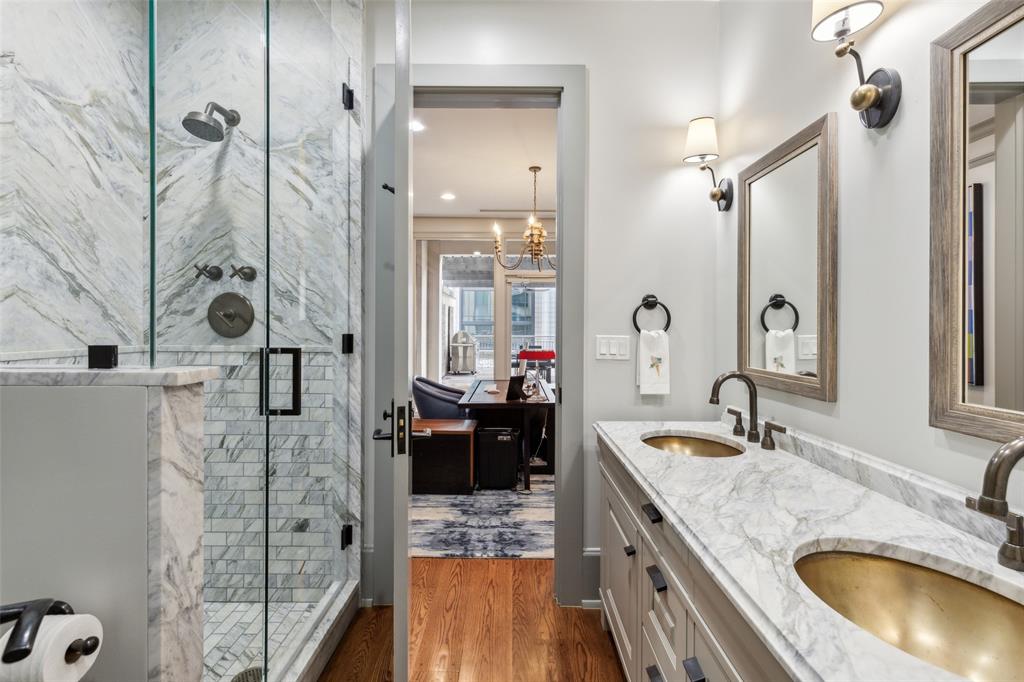 2300 Wolf Street, Unit 3D Dallas, TX 75201 - Photo 23 of 37 a bathroom with a granite countertop double vanity sink and mirror