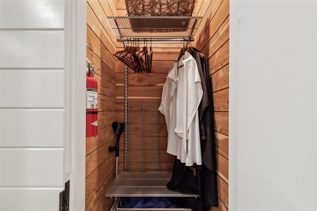 2300 Wolf Street, Unit 3D Dallas, TX 75201 - Photo 25 of 37 a view of walk in closet with clothes and white walls