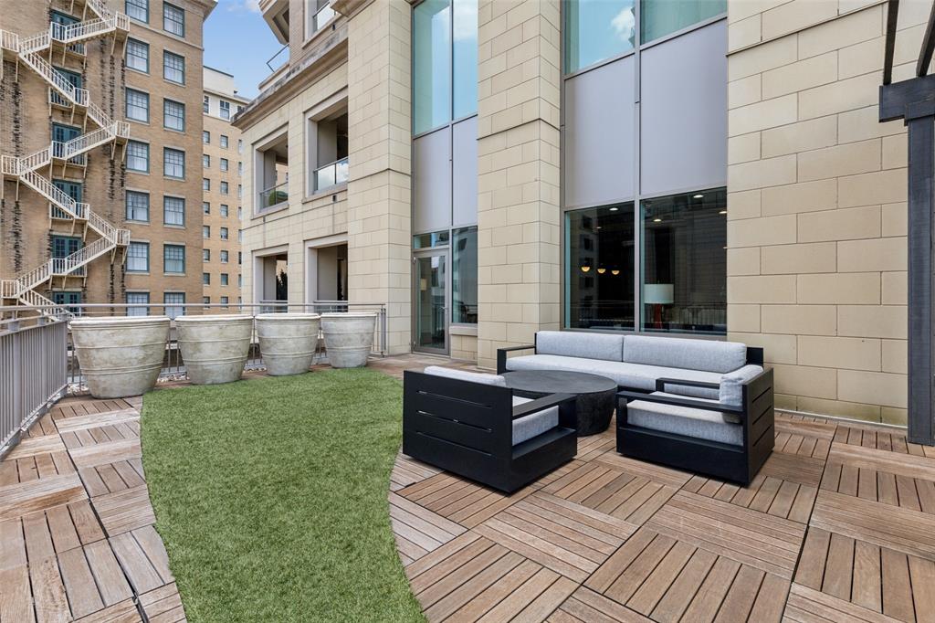 2300 Wolf Street, Unit 3D Dallas, TX 75201 - Photo 28 of 37 a view of a patio with couches table and chairs and potted plants