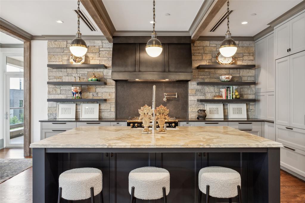 2300 Wolf Street, Unit 3D Dallas, TX 75201 - Photo 5 of 37 a kitchen with a table and a view of living room