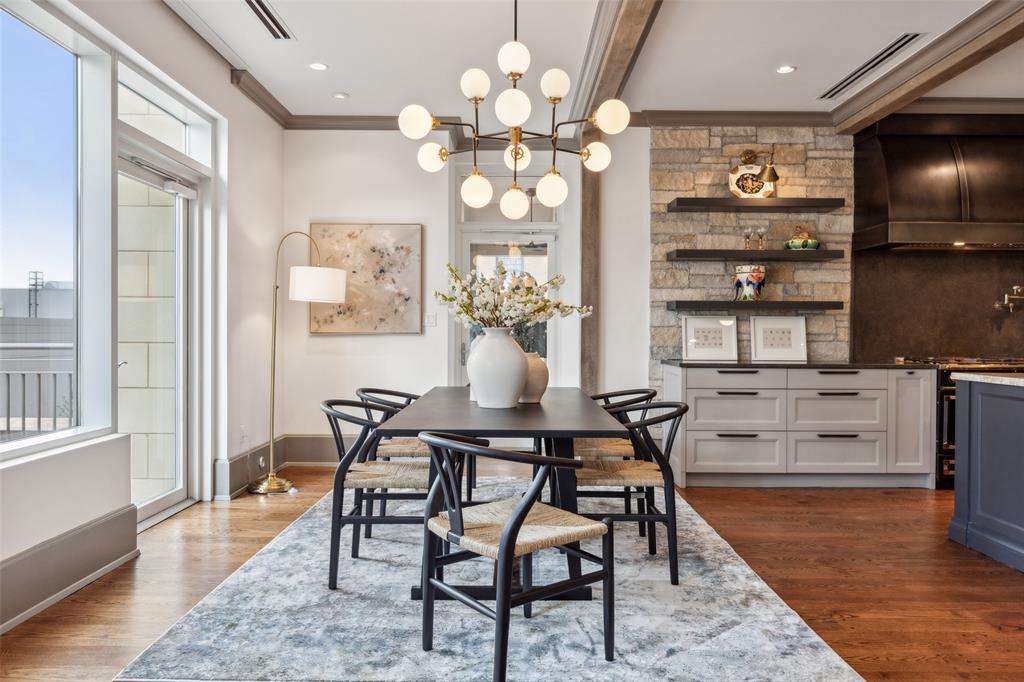 2300 Wolf Street, Unit 3D Dallas, TX 75201 - Photo 9 of 37 a view of a dining room with furniture and chandelier