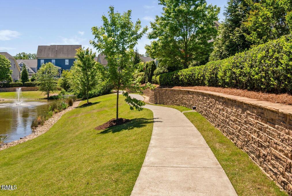 7421 Stonehenge Farm Lane Raleigh, NC 27613 - Photo 39 of 48 a swimming pool with outdoor seating and garden