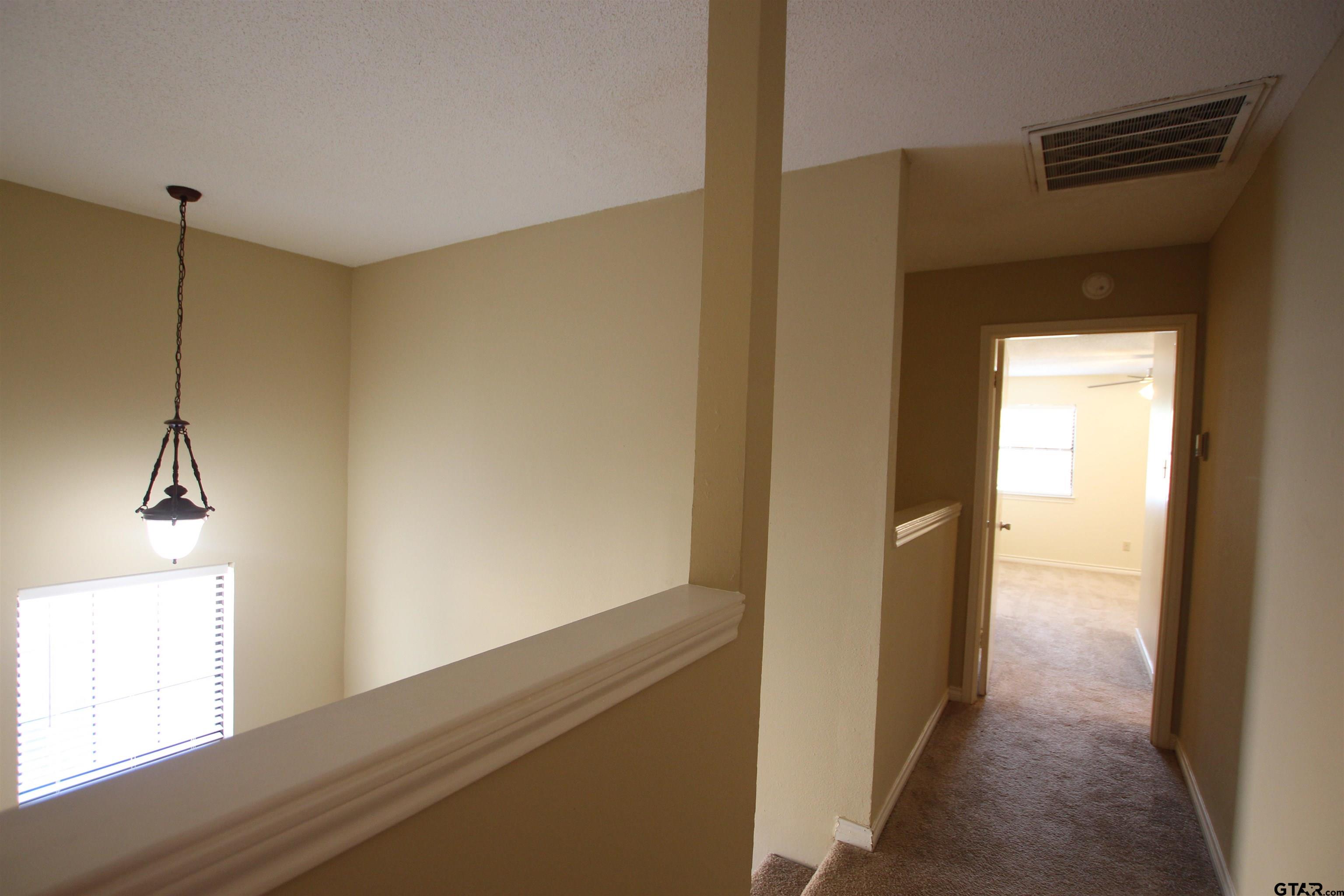 5875 Creekside Circle Tyler, TX 75703 - Photo 18 of 32 a view of hallway with window