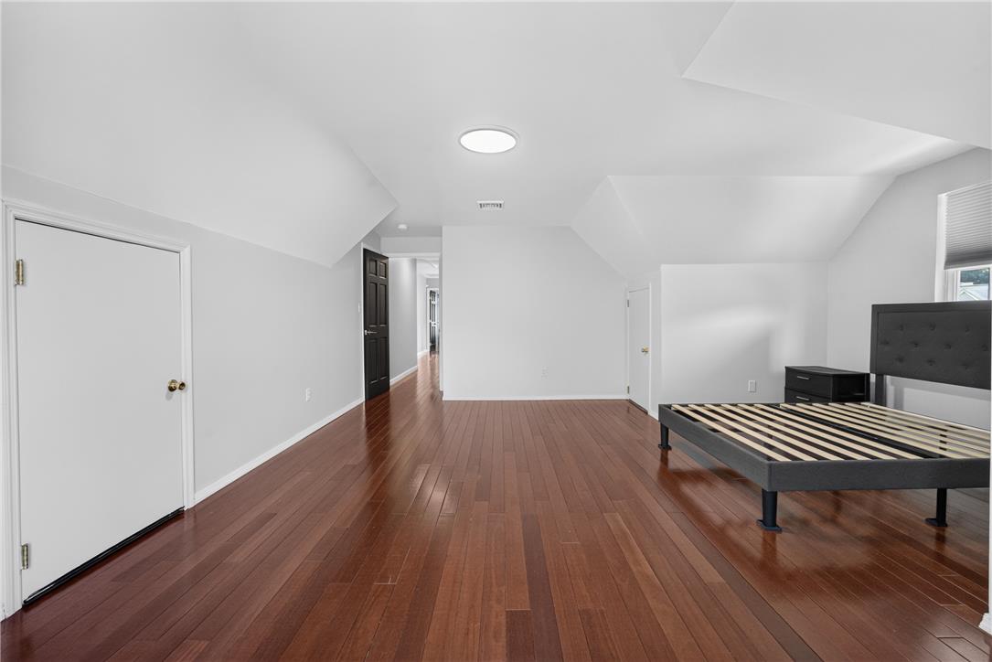 220 Pennbrook Road Stroudsburg, PA 18360 - Photo 36 of 60 Rich hardwood flooring creates a welcoming feel in this versatile bedroom, ready for personalization.