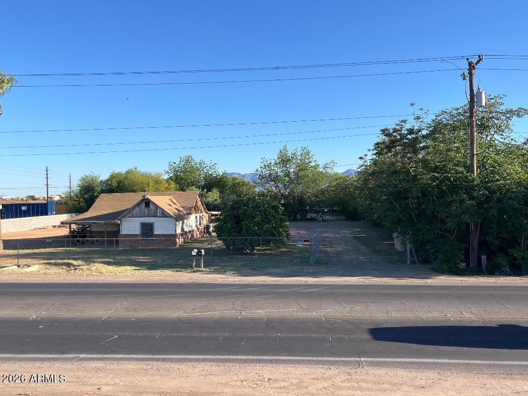 9115 West Broadway Road Tolleson, AZ 85353 - Photo 11 of 13 a view of yard with car parked
