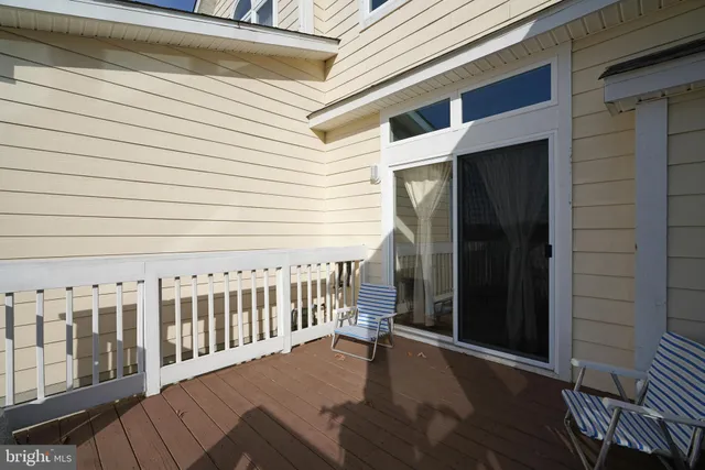 a balcony with wooden floor