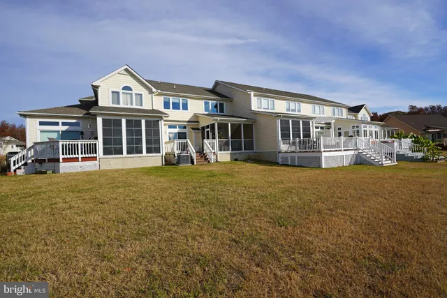a bedroom with a bed and chair