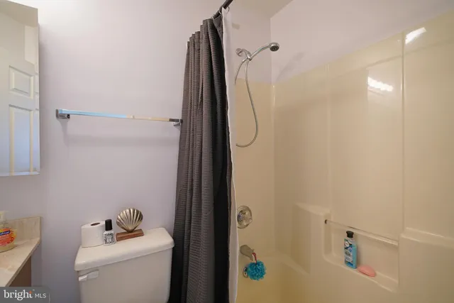 a front view of house with yard and parking