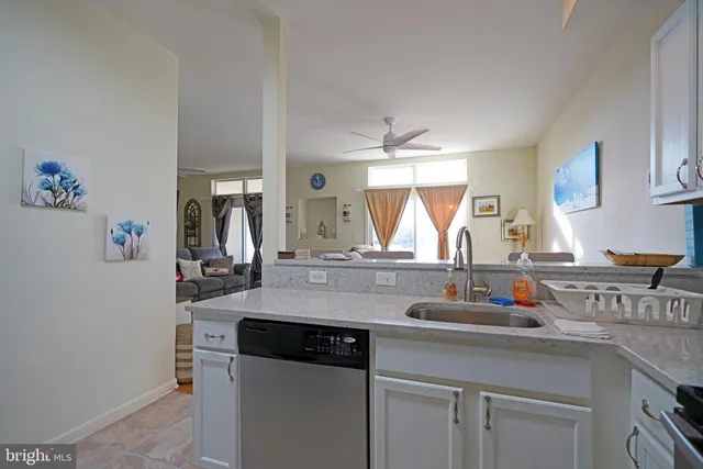 a kitchen with a sink and a refrigerator