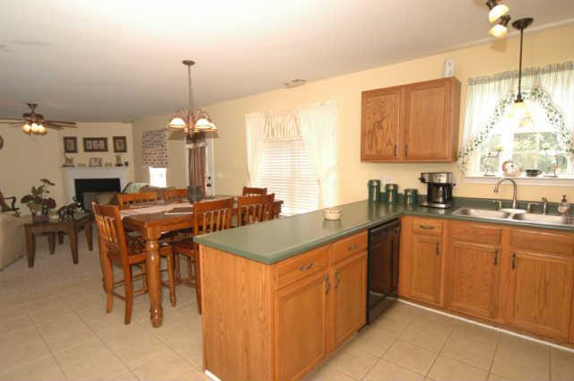 1428 Weston Lane Spring Hill, TN 37174 - Photo 11 of 19 a kitchen with cabinets and chairs