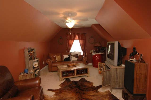 1428 Weston Lane Spring Hill, TN 37174 - Photo 16 of 19 a room with furniture and a chandelier