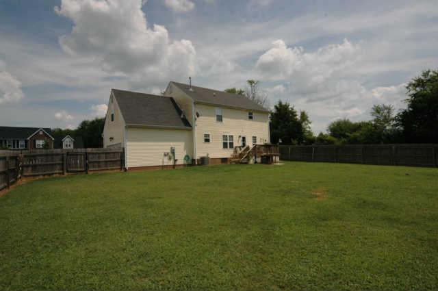1428 Weston Lane Spring Hill, TN 37174 - Photo 18 of 19 a view of a house with a back yard