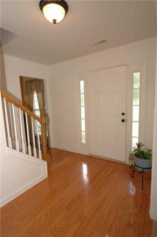 1428 Weston Lane Spring Hill, TN 37174 - Photo 4 of 19 an empty room with wooden floor and windows