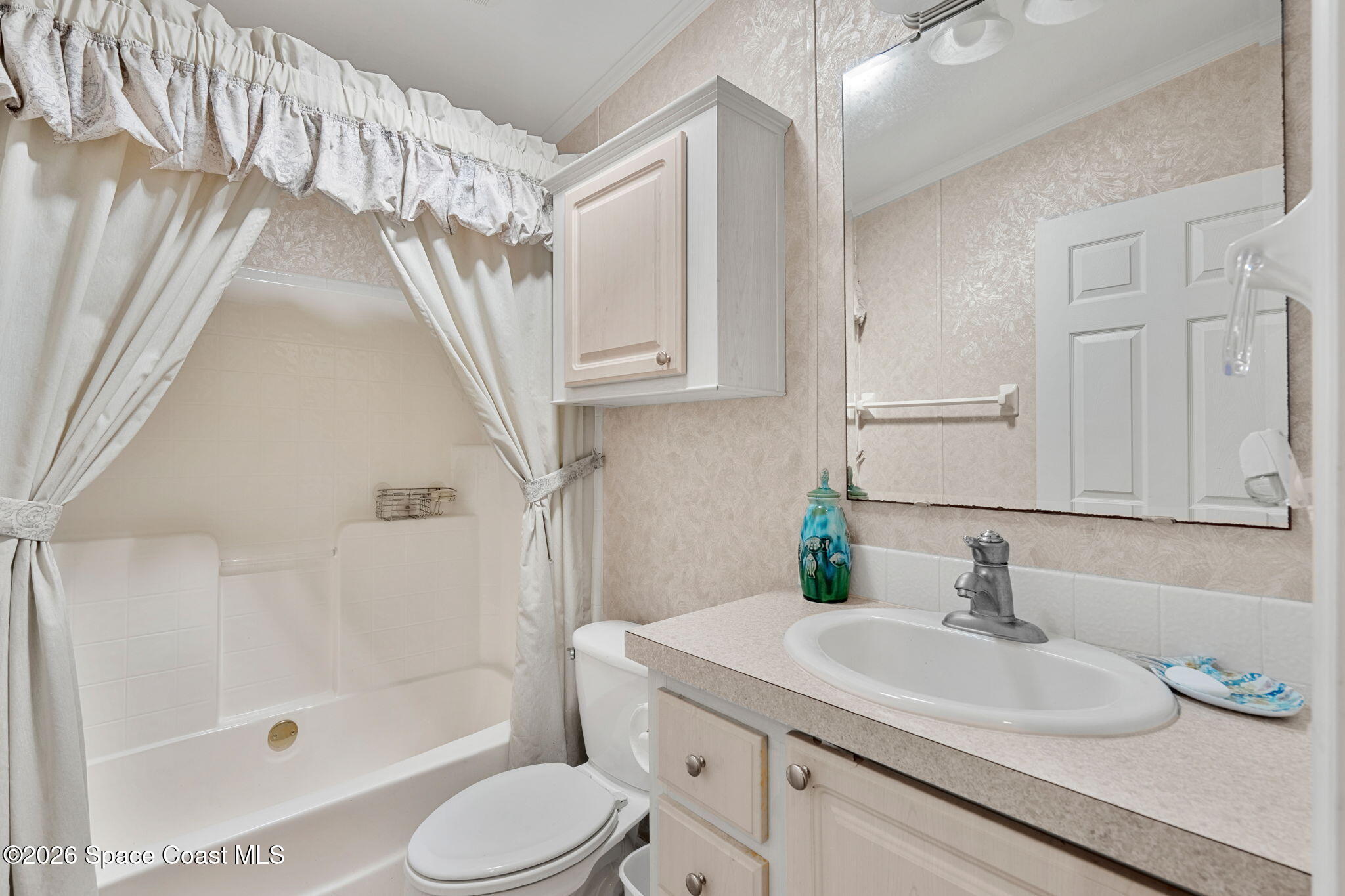 7505 Agawam Road Micco, FL 32976 - Photo 37 of 47 a bathroom with a sink toilet and shower