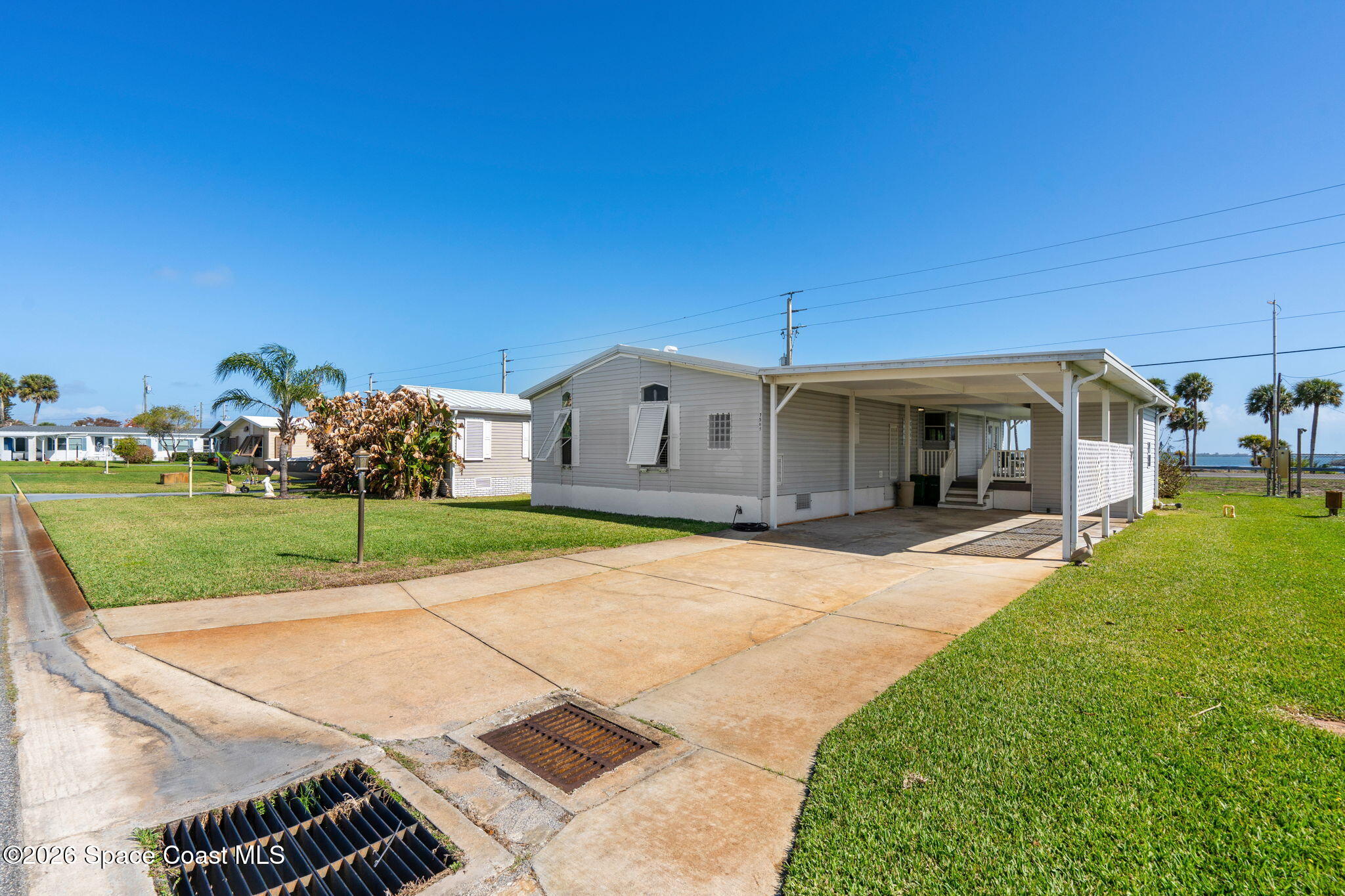 7505 Agawam Road Micco, FL 32976 - Photo 5 of 47 a view of a house with backyard and porch