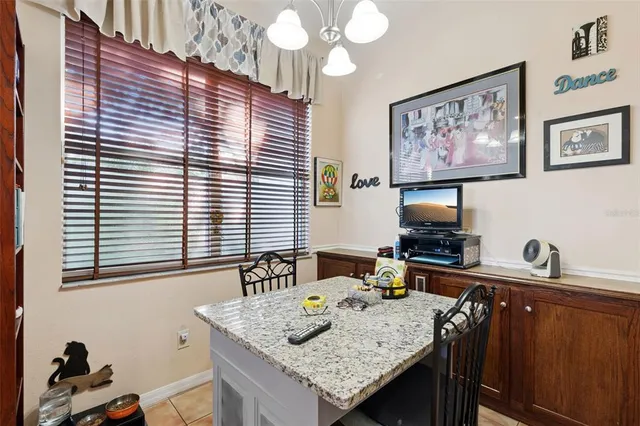 a kitchen with lots of counter top space and dining table