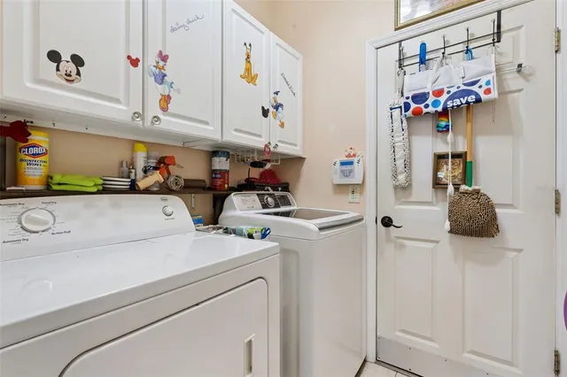 a aerial view of a house with swimming pool and green space