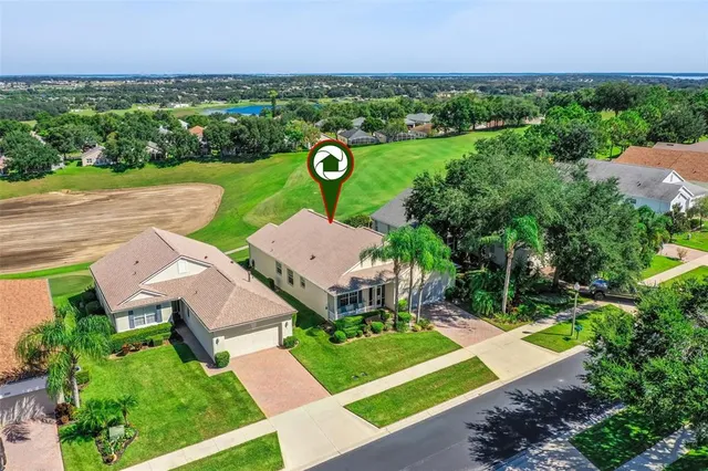 an aerial view of a house with outdoor space and street view