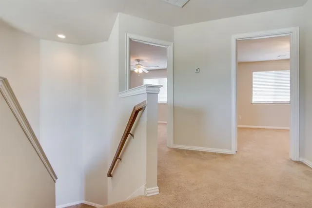 a view of a hallway with windows