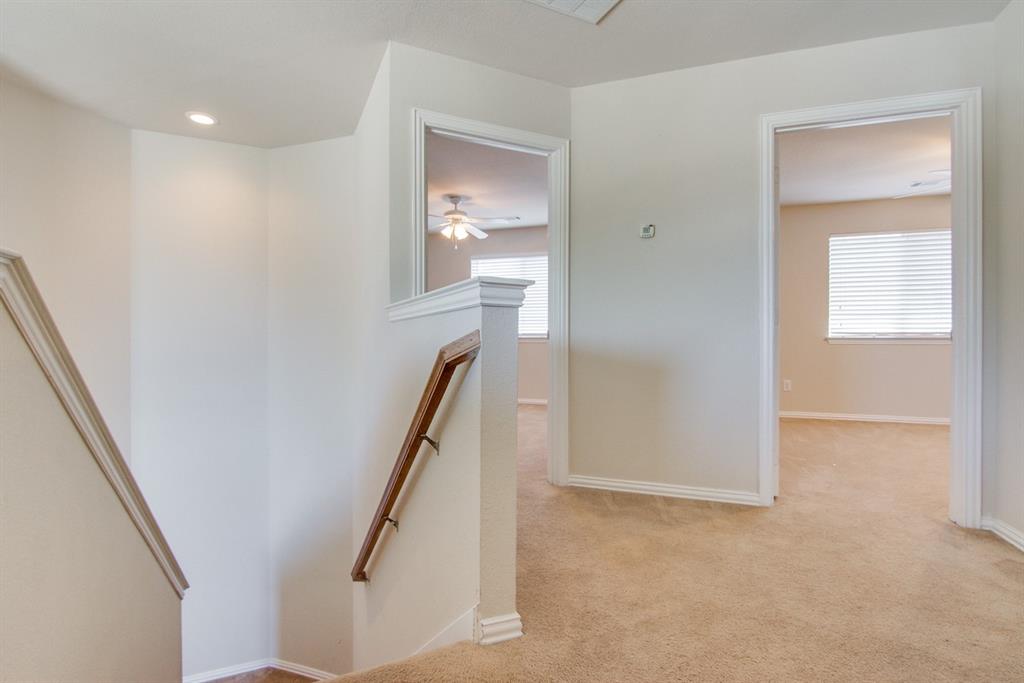 11800 Porcupine Drive Fort Worth, TX 76244 - Photo 10 of 12 a view of a hallway with windows