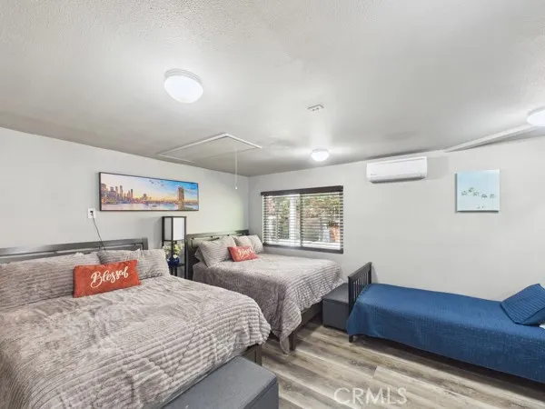 a bedroom with two beds and a couch