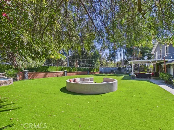 a backyard of a house with outdoor seating