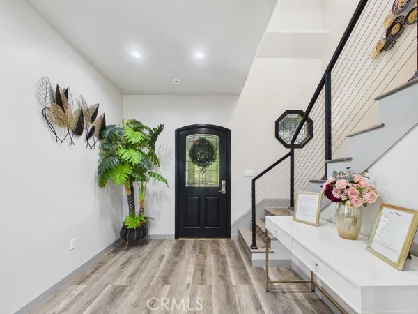 a view of entryway with flower pots