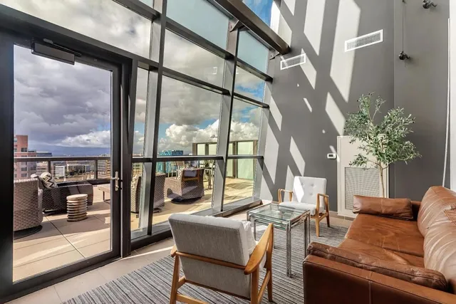 a view of a patio with a table and chairs