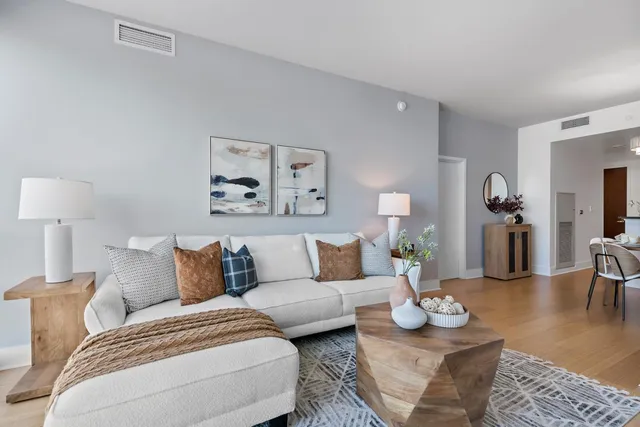 a kitchen with stainless steel appliances stove microwave and wooden floor