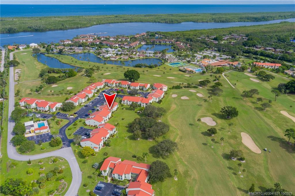 5433 Southeast Miles Grant Road, Unit 203 Stuart, FL 34997 - Photo 21 of 31 a view of lake from a city