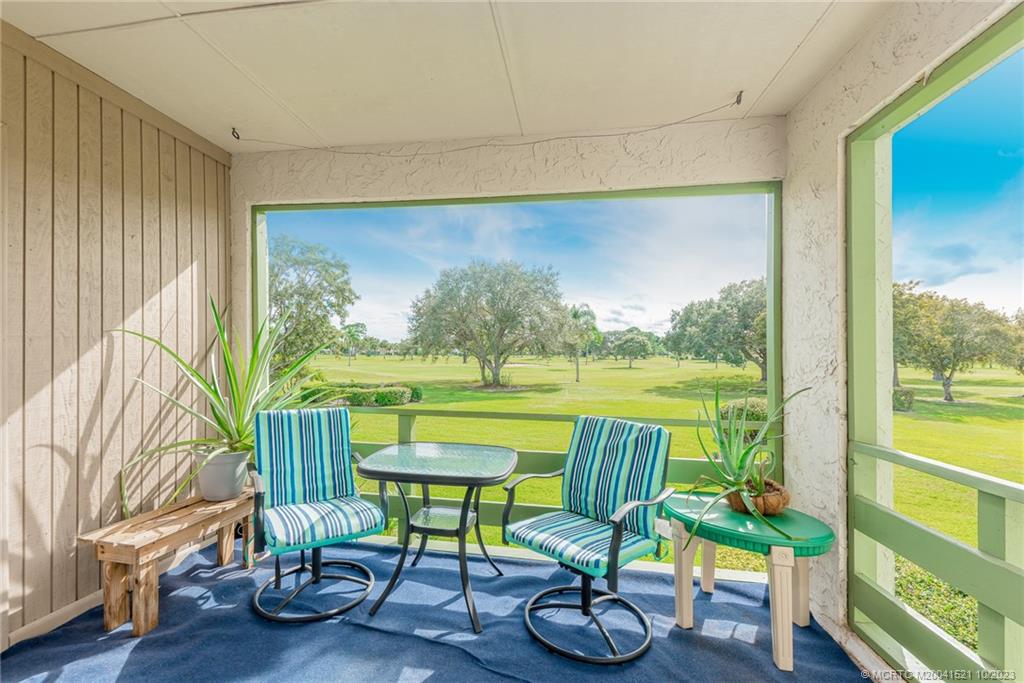 5433 Southeast Miles Grant Road, Unit 203 Stuart, FL 34997 - Photo 3 of 31 a view of a chairs and table in a room