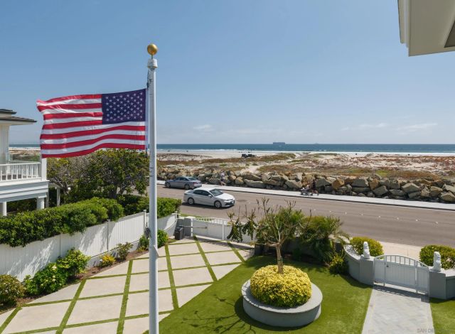 a view of a lake with couches and city view